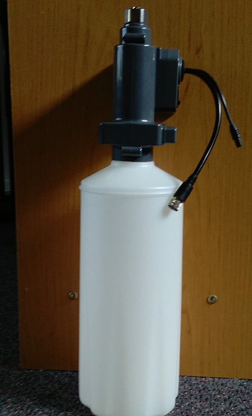 Picture of a soap dispenser pump and bottle. Approx. dimensions once installed 380mm x 130mm