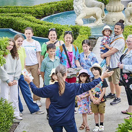 Craig Brown Photographer's image of a lady giving families a tour of the Hamilton Gardens