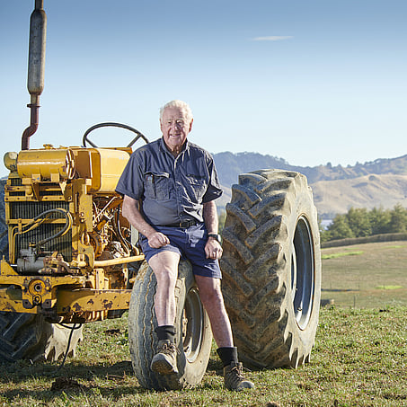 Craig Brown Photographer's portrait image of a man sitting on a tractor