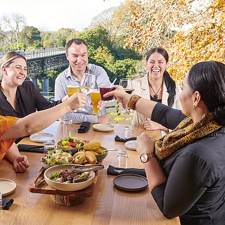 Craig Brown Photographer's image of a group of people having lunch by the Waikato River