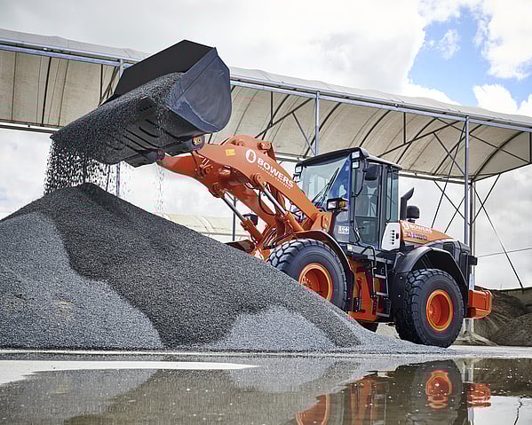 Craig Brown Photographer's image of a digger on site with a bucket of gravel