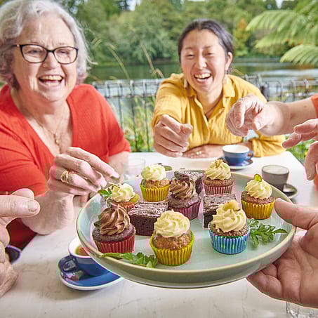 Craig Brown Photographer's image of a group of people enjoying mini cupcakes at a restaurant by the river