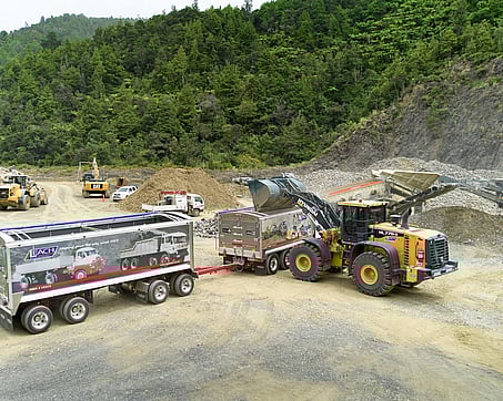Craig Brown Photographer's image of diggers loading trucks at a work site