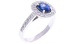 Cushion cut Ceylonese sapphire with round brilliant diamonds set in 18ct white gold