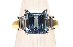 Step cut Aquamarine with trapezoid diamonds set in Platinum & 18ct yellow gold