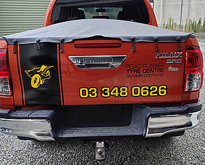 Vehicle graphics on back of Road Rubber Tyre Centre vehicle alternate design