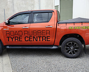 vehicle graphics on left side of Road Rubber Tyre Centre vehicle alterante design