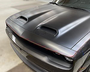 left and front view of Dodge Challenger with pinstriping