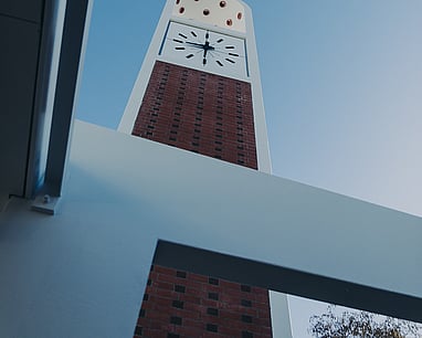 A low angle photo of the iconic clock tower above Te Mako.
