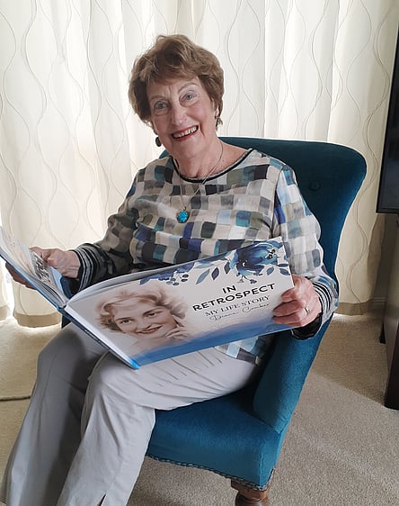 Diane Comber with her life story book