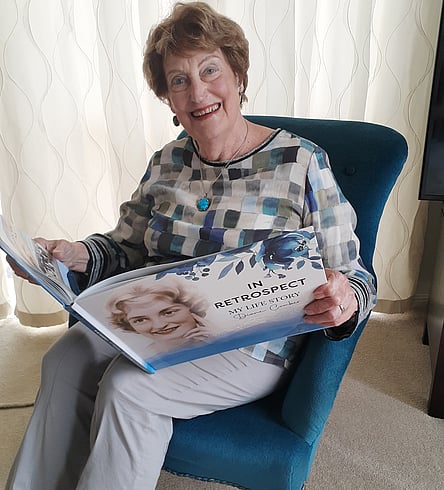 Diane Comber with her life story book