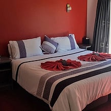 A large bed with decorative towels