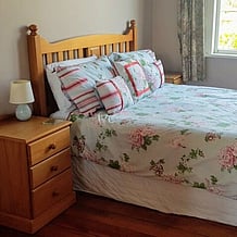 Bedroom with large bed and bedside table