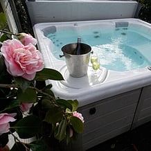 Luxurious spa pool with a champagne bottle in a cooler