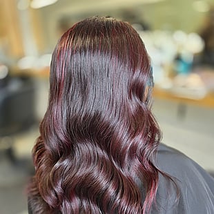 A rich burgundy plum hair colour, shiny and long by Hair by Shiyee.
