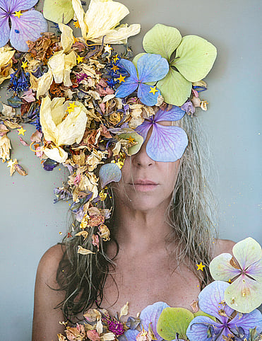 My first ever commission, first we photographed, tricky as it was a secret, then I laid out a selection of fresh and dried flowers, rephotographed it, printed large and finished with gold leaf.