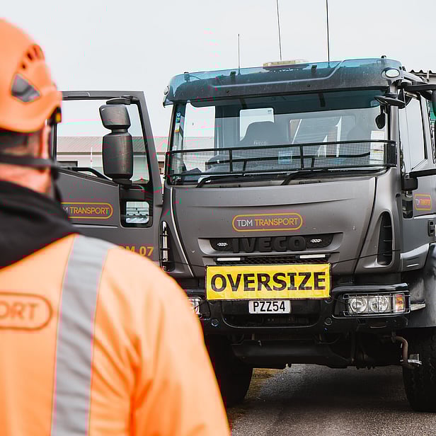 TDM Transport staff member moving modular homes in Hamilton, New Zealand