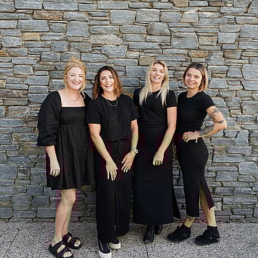 The Salon stylists standing together outside the Salon.