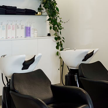 The basin area of The Salon with EVO hair products.