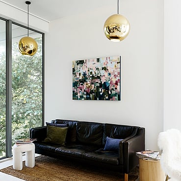 A light bathed couch to sit on at The Salon queenstown.