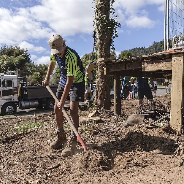 Ultrascape landscape staff member digging on a property in Rotorua
