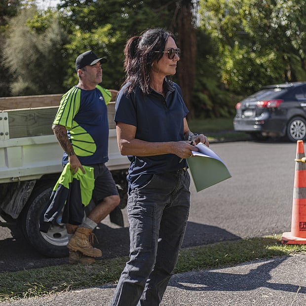 One of the founders of Ultrascape looking on at the landscaping work being performed at a Rotorua address