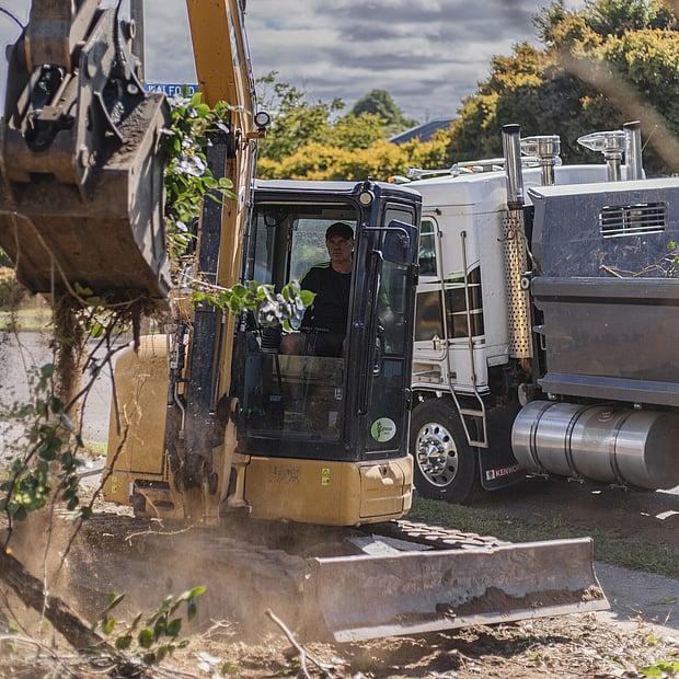 a worker from Ultrascape Landscapes working in a digger on a Rotorua property