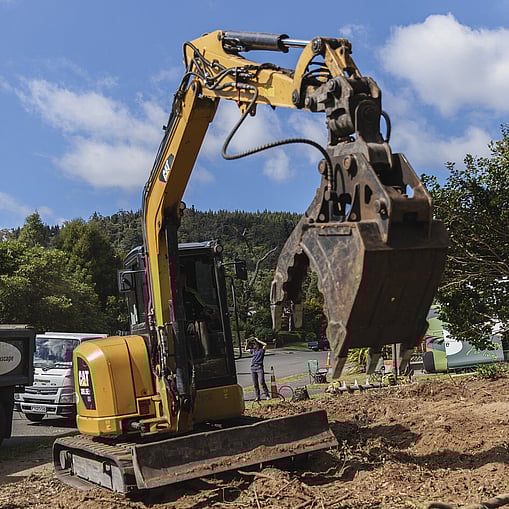 Ultrascape team using a digger for site earthworks in a property in Rotorua