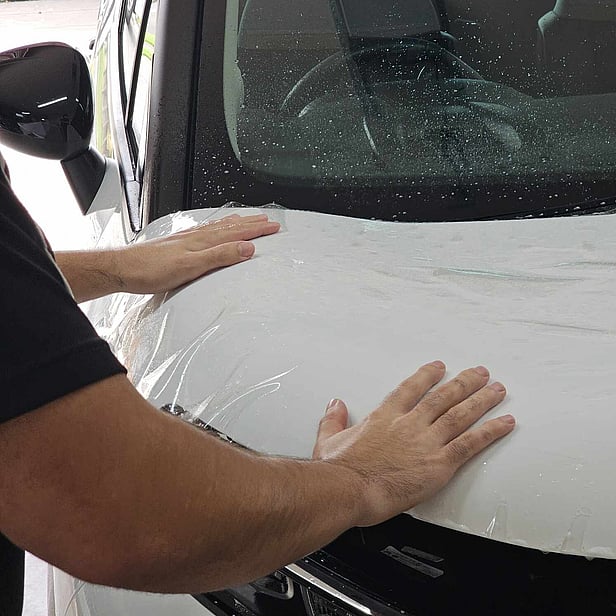 paint protection film being applied to protect your vehicle against minor scratches and abrasions while preserving your paint's original finish