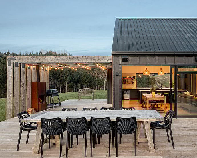 outdoor entertaining on black barn style home