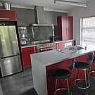 The red kitchen and island bench at 14A Cologne Street