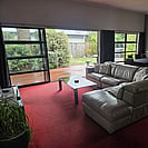 Lounge area of 14 Cologne St with backyard in the background