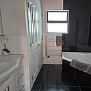 Large bathroom with bathtub