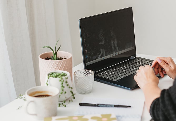 Image of Kelly working at her laptop. Image for "what is a favicon" blog post by Kelly Boxell Creative Box Te Awamutu Graphic Designer