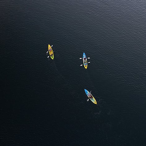 Drone view of small group tour kayaking out to visit glow worms in Rotorua New Zealand