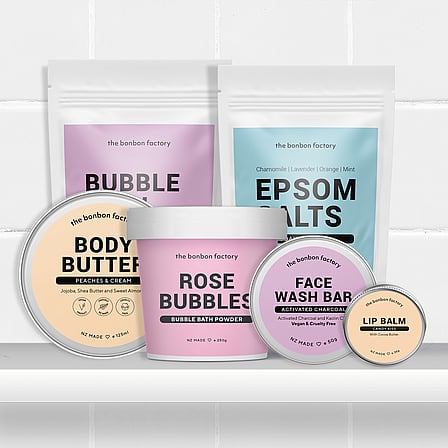 A selection of bath products on a bathroom shelf