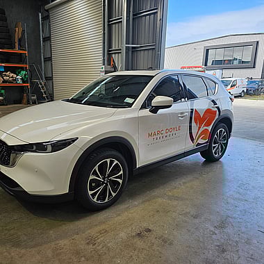 Weather-resistant vinyl car wrap with bold branding