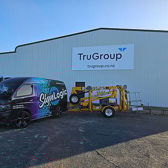 Commercial building facade signage with bold branding