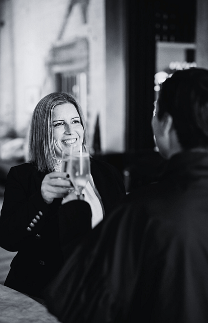 Rebekah Garner, event specialist and owner from The Event Girl sharing a champagne with a client