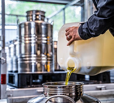 Pouring fresh olive oil
