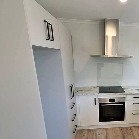 Image of fresh new neutral toned kitchen. Clarkin Road small building. Built by Ardent Building Developments, Hamilton. Waikato, New Zealand.