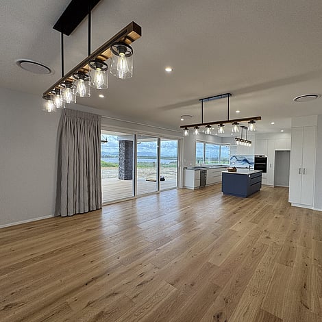 Image of elegant country home on Te Wharepu Road new home build with wooden flooring and feature lights. Built by Ardent Building Developments, Hamilton. Waikato, New Zealand.