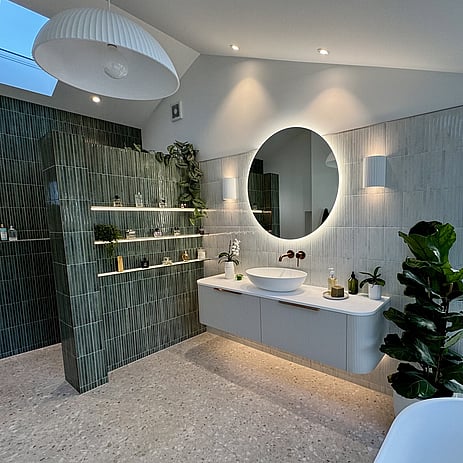 Image of a beautiful vertical finger tiled bathroom in deep green & soft grey in this Bedford Road bathroom extension. Built by Ardent Building Developments, Hamilton. Waikato, New Zealand.