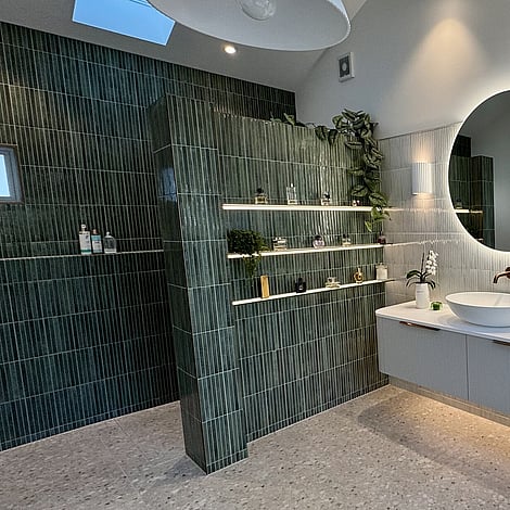 Image of a beautiful vertical finger tiled bathroom in deep green & soft grey in this Bedford Road bathroom extension. Built by Ardent Building Developments, Hamilton. Waikato, New Zealand.