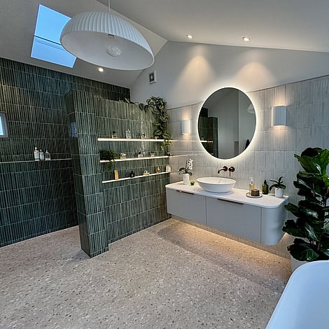 Image of a beautiful vertical finger tiled bathroom in deep green & soft grey in this Bedford Road bathroom extension. Built by Ardent Building Developments, Hamilton. Waikato, New Zealand.
