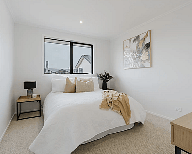 Image of natural light filled bedroom and soft neutral styling in Collinson Street, Pirongia new home, by Waikato residential builders Whitechurch Construction Limited.