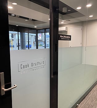 Window Interior Signage produced and installed for Cook Brothers Construction by Universal Sign Co. Chch Signwriters