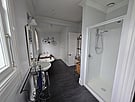 Bathroom with shower and bathtub