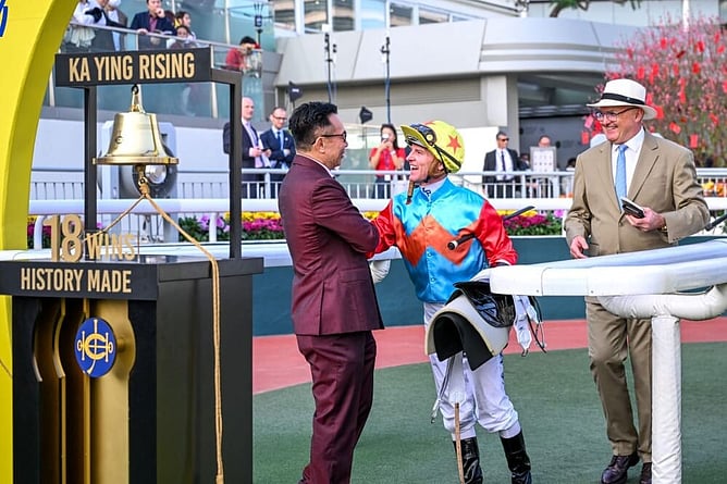 Zac Purton and David Hayes celebrate with Leung Shek Kong of the Ka Ying Syndicate. -  Photo: Hong Kong Jockey Club