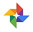 Google Photos logo featuring a pinwheel-shaped icon with four triangular segments in red, blue, green, and yellow